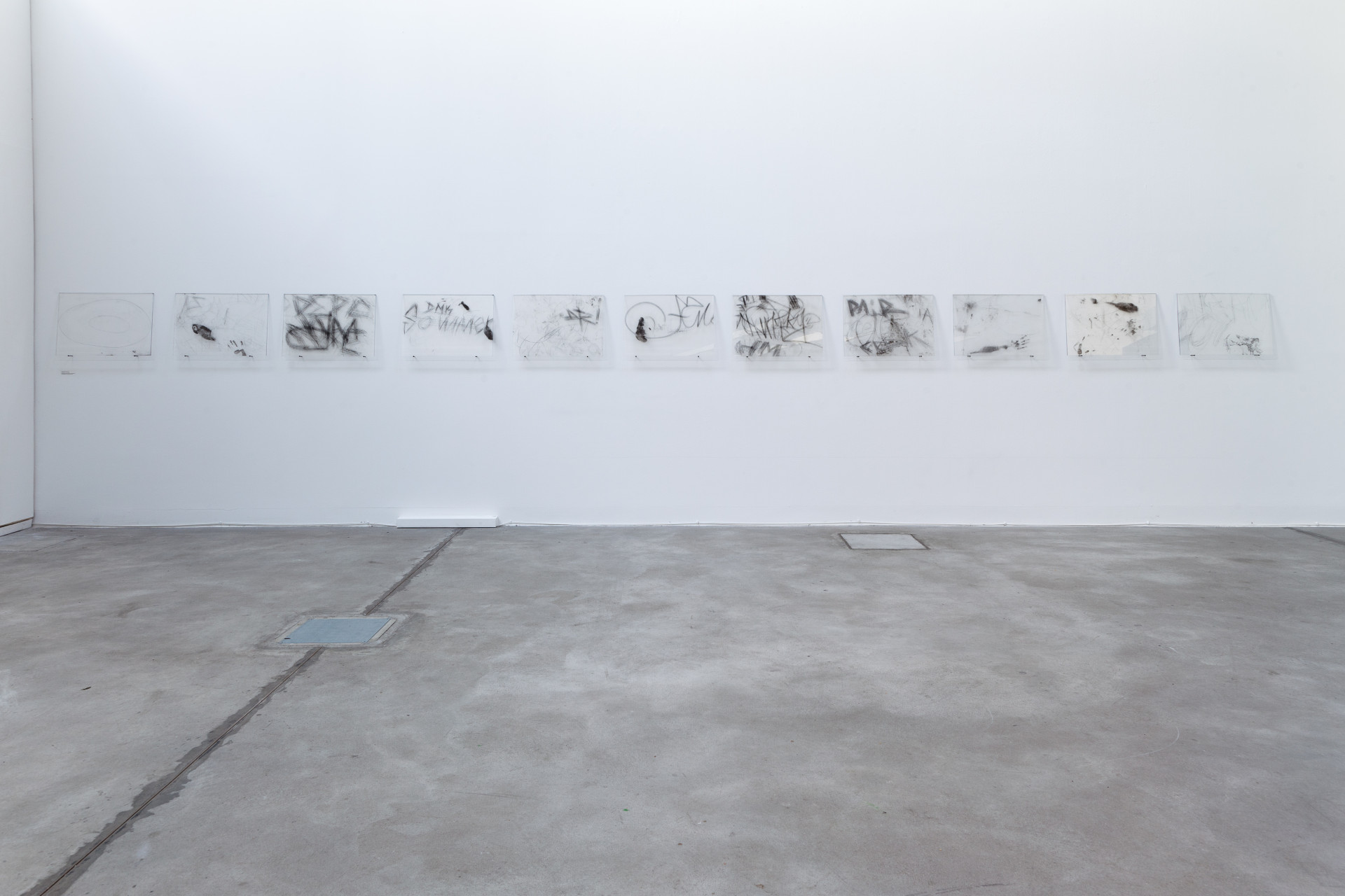 and graffiti, captured from Berlin’s subway and bus shelters, revealing hidden histories and tensions in urban spaces. Nadia Kaabi-Linke, Berlin à fleur de peau.