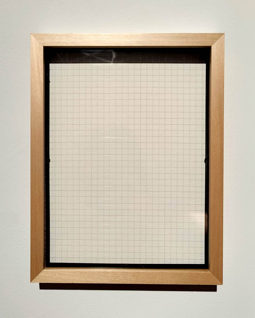 Framed piece of grid paper.