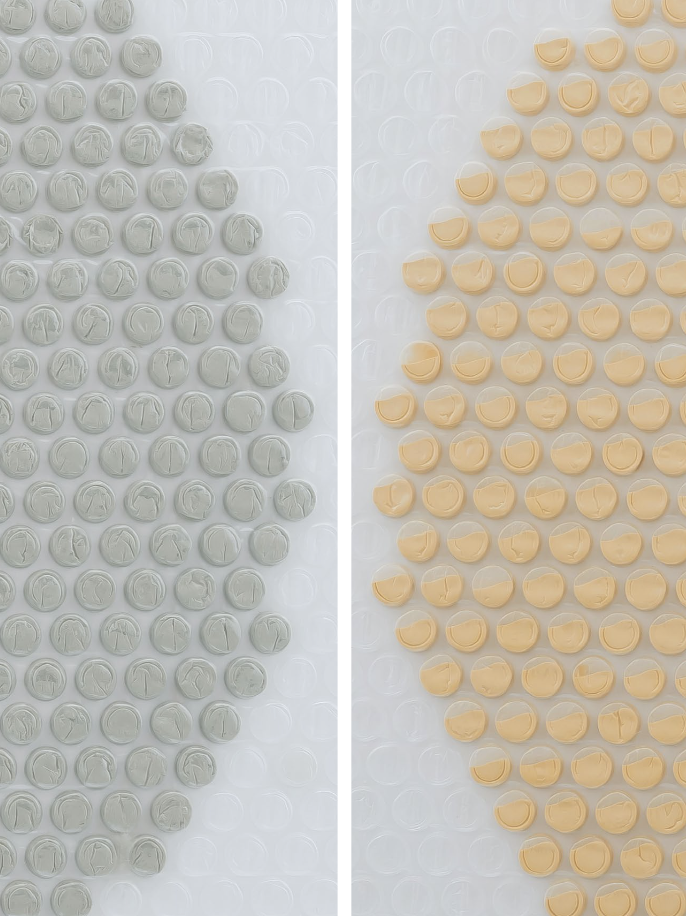 Close up of an artwork, a circle made by injecting grey and yellow paint in some of the bubbles of a bubble wrap