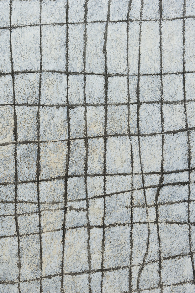 Detail of transfer prints of a hand-drawn grid on canvas