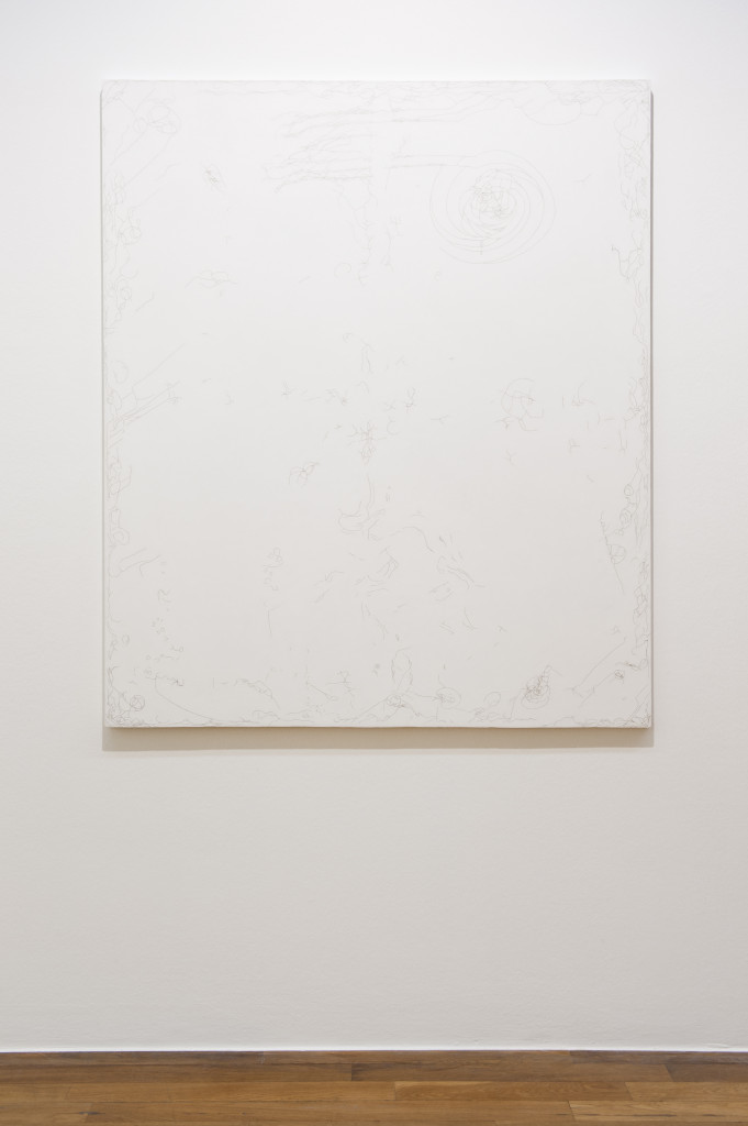 A white painting hanging on a wall