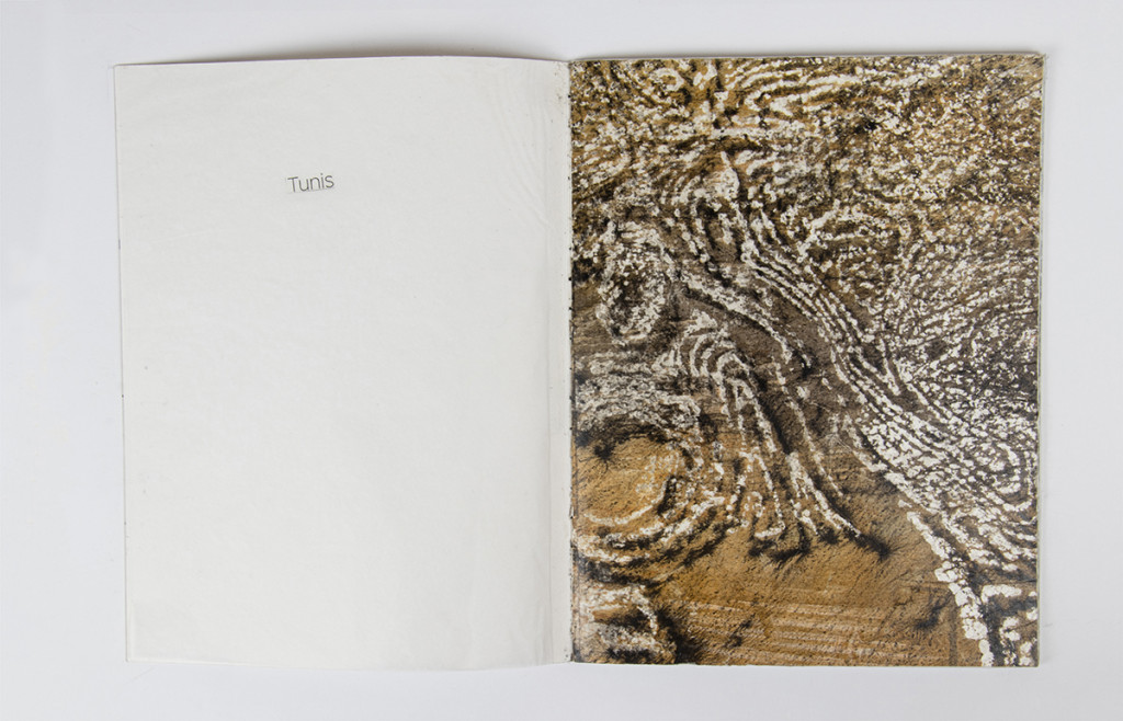 Open artist book with a monotype on the right side.