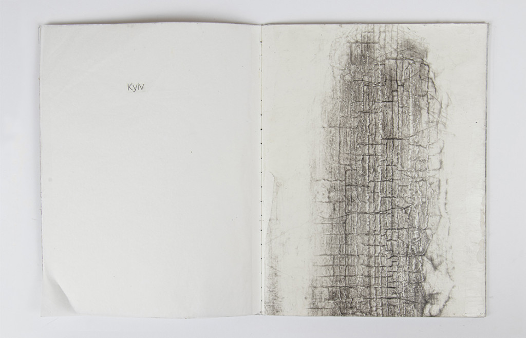 Open artist book with a print on the right side.