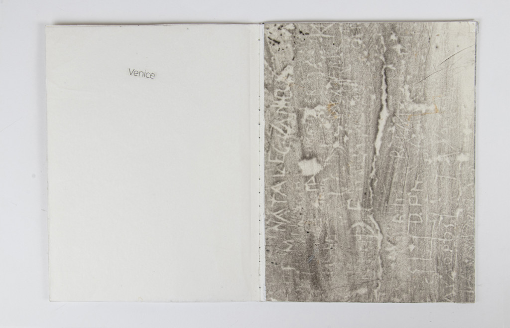 Open artist book with a frottage covering the right side.