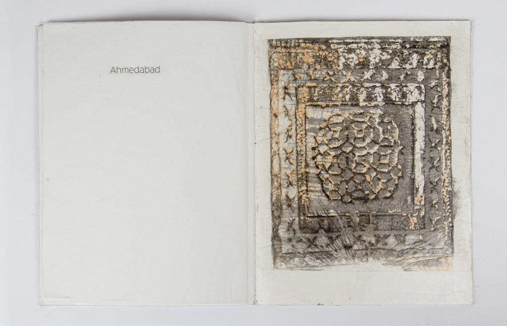 Open artist book with a frottage covering the right side.