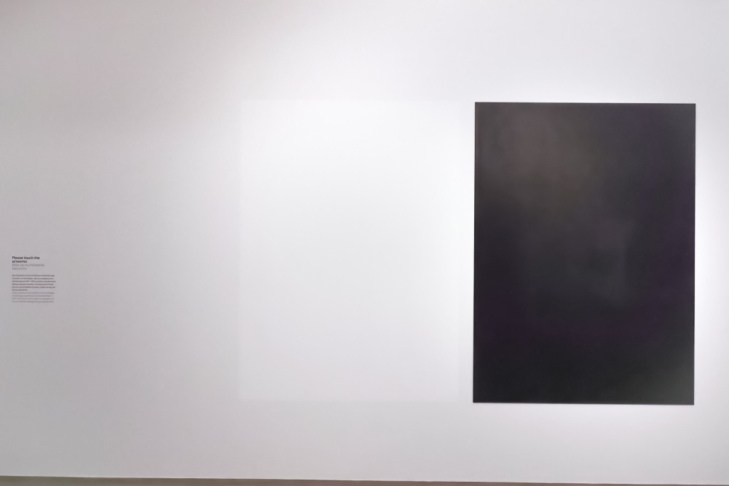 A black and white rectangle on a white gallery wall.