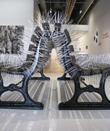 Two benches covered with bird spikes memorializes a society that celebrates the fact that its reunification lasts longer than its separatio, Back to Back, 2020, Nadia Kaabi-Linke