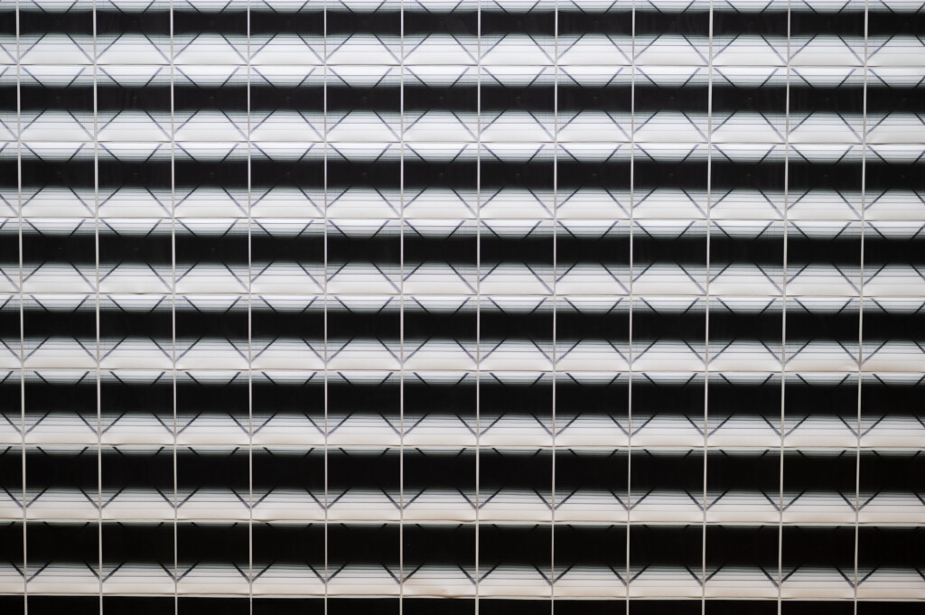 Close up of an artwork, pictures with a slightly changing black and white image aligned close to each other ( Close Up) / Squeezed in Infinity II, 2023, Nadia Kaabi-Linke, Series of 514 photographs