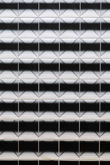 Close up of an artwork, pictures with a slightly changing black and white image aligned close to each other ( Close Up) / Squeezed in Infinity II, 2023, Nadia Kaabi-Linke, Series of 514 photographs