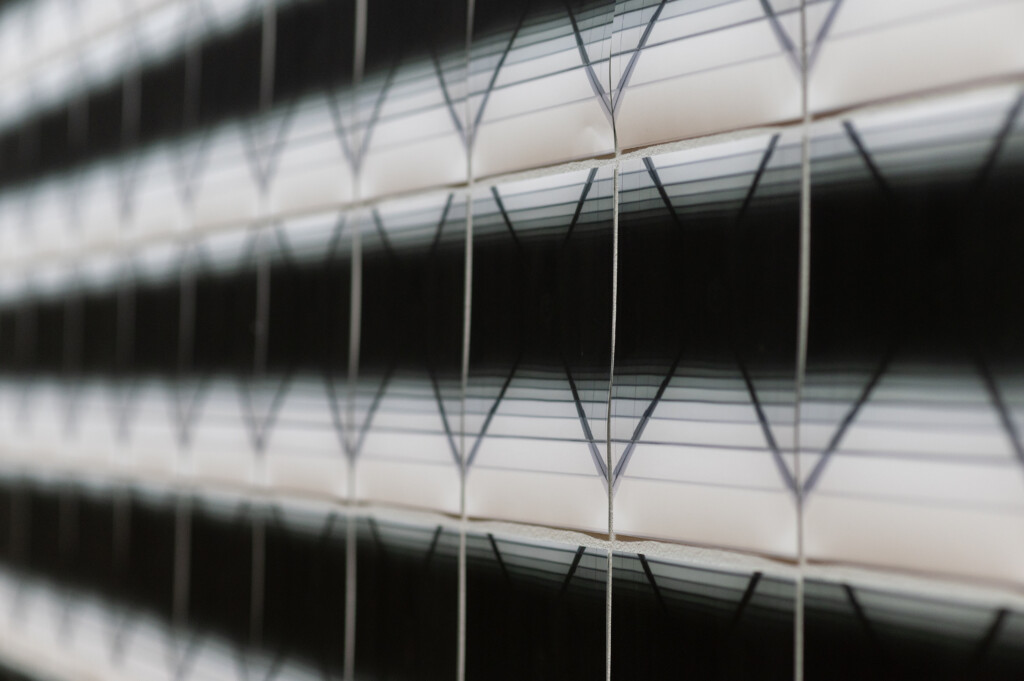 Close up of an artwork, pictures with a slightly changing black and white image aligned close to each other ( Close Up) / Squeezed in Infinity II (Detail view), NAMU_Kyiv, 2023 Nadia Kaabi-Linke
