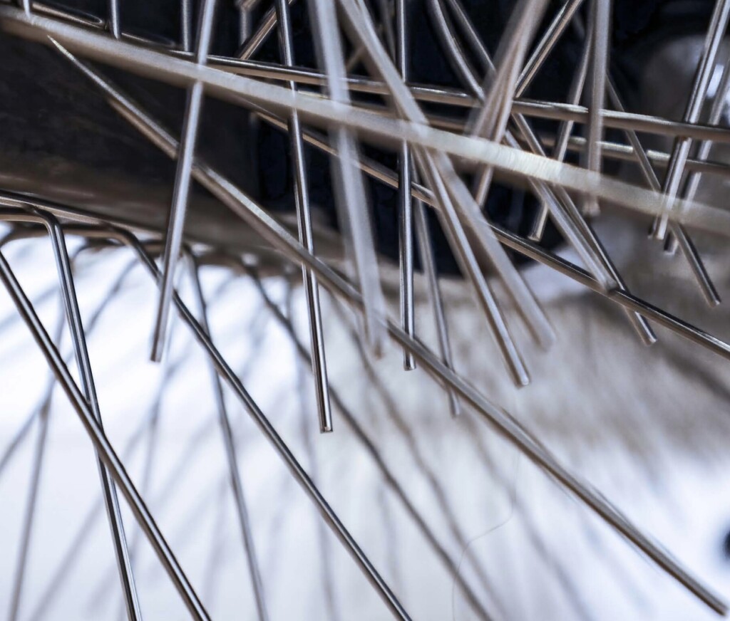 Close up of an Object covered in bird spikes.
