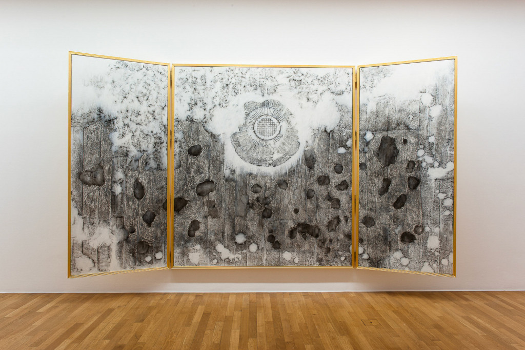 Open triptych outside coated in gold leaf, inside showing transferred traces of World War One.