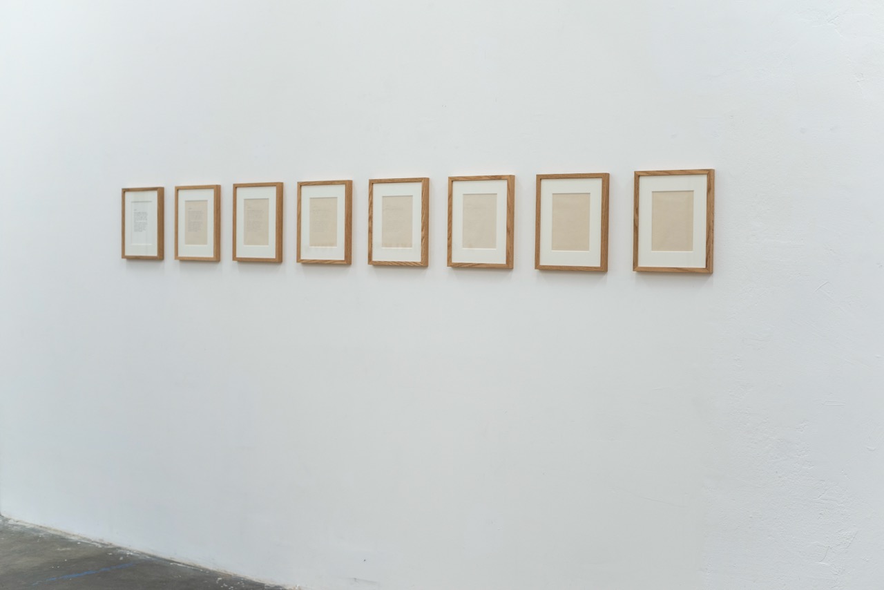 Series of eight paperworks with frames.