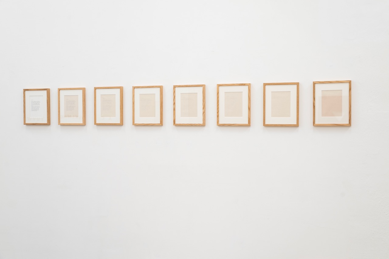 Series of eight paperworks with frames.