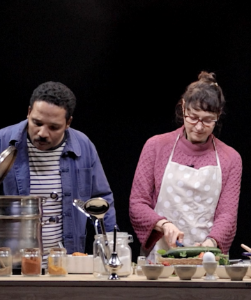 A man and a woman standing behind a kitchen island, cooking and chatting. Nadia Kaabi-Linke Life Kitchen