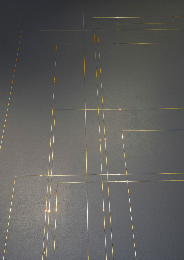 Outlines of prison cells inlayed in a grey platforlm as an art installation