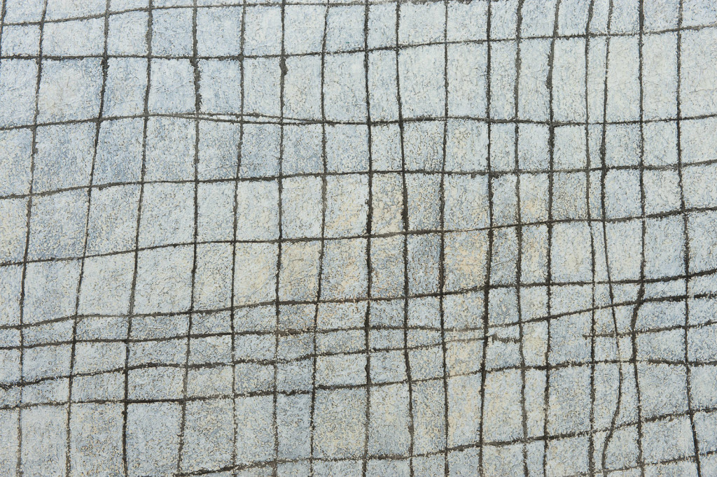 Painting of an irregular, grid-like structure in white and grey hues.