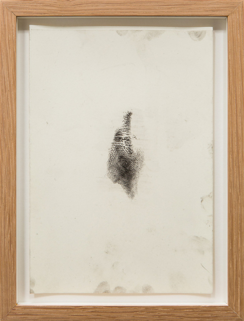 Transfer prints of body parts with black velvet powder on film and paper, framed.