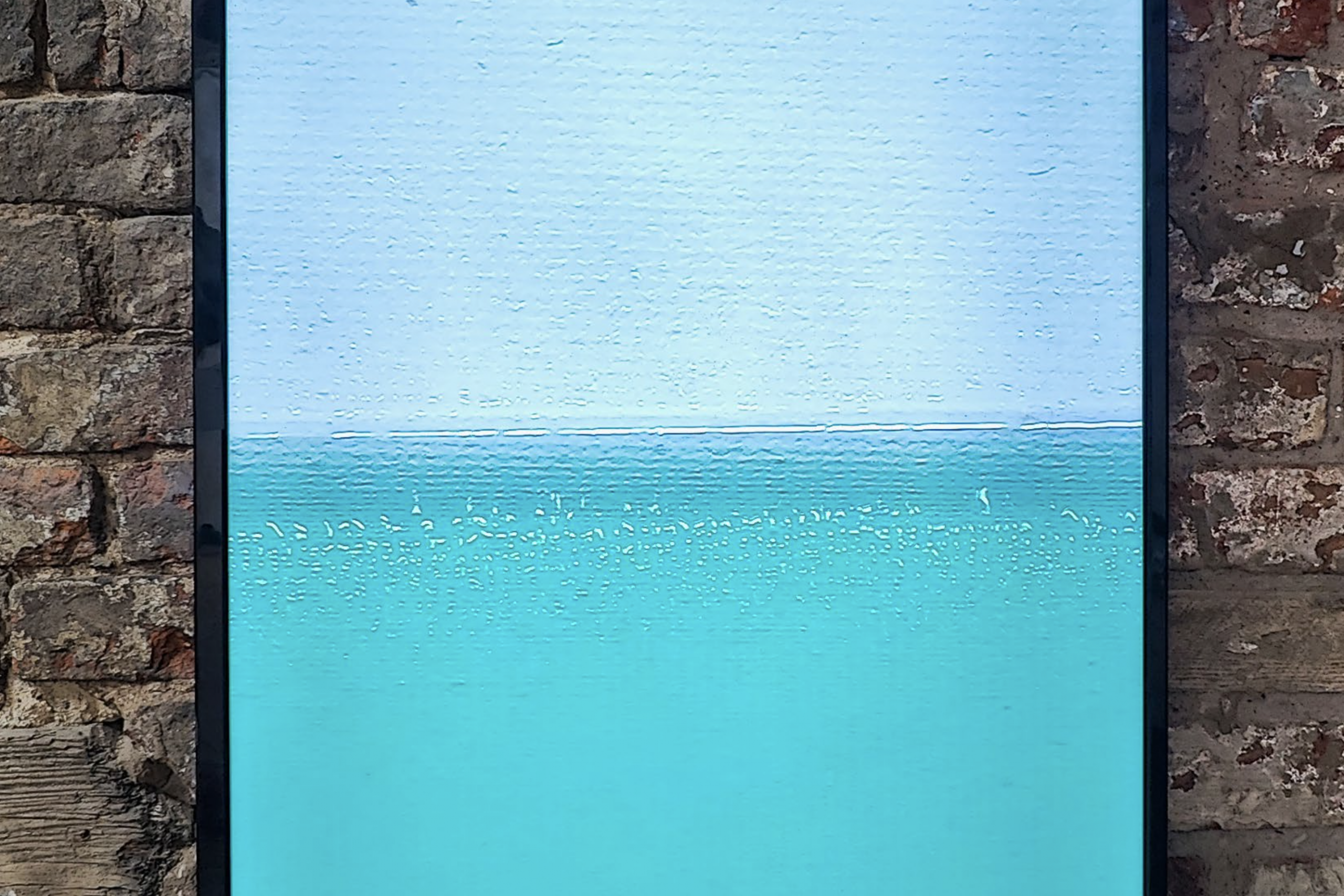 Detail of a video of the sea playing on a screen. Nadia Kaabi-Linke Under Sea Heart Beats