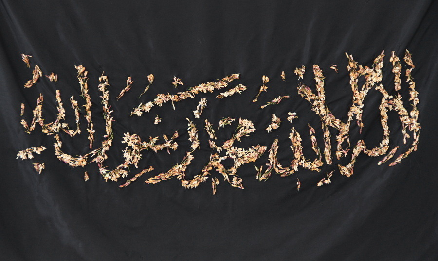 Black cloth with temporary embroidery with jasmin flowers.