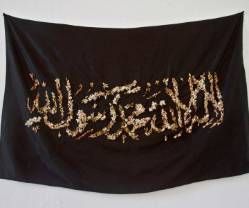 Black cloth with temporary embroidery with jasmin flowers.