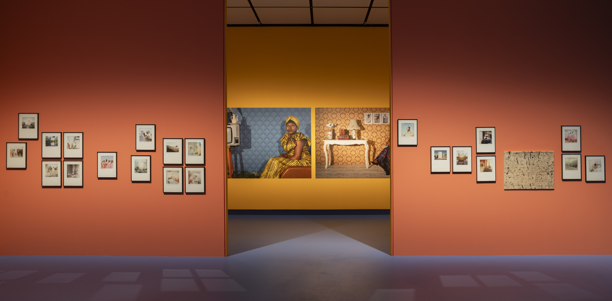 A series of photographs installed in an exhibition space.